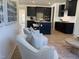 Modern kitchen with dark cabinets, a center island, and stainless steel appliances, flowing into the living area at 4327 Emeline Way # 10, Fuquay Varina, NC 27526