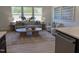 Cozy living room featuring large windows, comfortable seating, and stylish decor at 4327 Emeline Way # 10, Fuquay Varina, NC 27526