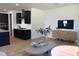 Spacious living area featuring a large sofa, modern decor, and open to the kitchen at 4327 Emeline Way # 10, Fuquay Varina, NC 27526