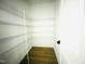 A spacious walk-in closet with wire shelving on the wall above wood-look flooring at 4327 Emeline Way # 10, Fuquay Varina, NC 27526