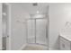 Bathroom with a glass enclosed shower, tile floors, and neutral walls at 545 Eversden Dr, Zebulon, NC 27597