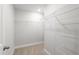Walk-in closet featuring wire shelving and neutral carpeting at 545 Eversden Dr, Zebulon, NC 27597