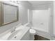 Clean bathroom with white fixtures and a tub shower combo at 708 N Allen Rd, Wake Forest, NC 27587