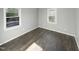 Bright bedroom with dark hardwood floors at 708 N Allen Rd, Wake Forest, NC 27587