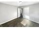 Bright bedroom featuring wood-look floors and ample space at 708 N Allen Rd, Wake Forest, NC 27587