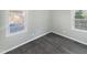 Bright bedroom with hardwood floors and large windows at 708 N Allen Rd, Wake Forest, NC 27587