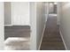 Long hallway with vinyl flooring leading to other rooms at 708 N Allen Rd, Wake Forest, NC 27587