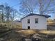 Rear view of the house showcasing a white brick exterior at 708 N Allen Rd, Wake Forest, NC 27587