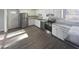 Renovated kitchen with stainless steel appliances and white cabinets at 708 N Allen Rd, Wake Forest, NC 27587