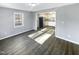 Spacious living room with wood-look floors and kitchen view at 708 N Allen Rd, Wake Forest, NC 27587