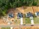 Aerial view of new homes in a neighborhood with wooded areas and landscaping at 95 Purslane Dr, Franklinton, NC 27525