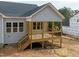 A spacious back deck with natural wood floors and black railings, perfect for outdoor entertaining at 95 Purslane Dr, Franklinton, NC 27525