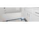 Bathroom featuring white cabinets, and white bathtub with chrome fixtures at 95 Purslane Dr, Franklinton, NC 27525