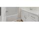 Bathroom with shower-tub combo and white vanity with modern fixtures at 95 Purslane Dr, Franklinton, NC 27525