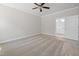 Bedroom with neutral carpeting, a ceiling fan, and entry into a bathroom at 95 Purslane Dr, Franklinton, NC 27525