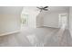 Spacious bedroom with a ceiling fan, neutral carpet, and a window for natural light at 95 Purslane Dr, Franklinton, NC 27525