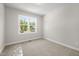 Bright bedroom with large window providing natural light and neutral carpet at 95 Purslane Dr, Franklinton, NC 27525
