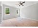 Spacious bedroom featuring large windows for ample natural light and a ceiling fan at 95 Purslane Dr, Franklinton, NC 27525