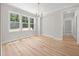 Bright dining area with large windows and modern chandelier lighting at 95 Purslane Dr, Franklinton, NC 27525
