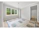 Bright dining room featuring large windows with backyard views and chandelier at 95 Purslane Dr, Franklinton, NC 27525