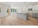 Modern kitchen with island, granite countertops, stainless appliances, and bright breakfast area at 95 Purslane Dr, Franklinton, NC 27525