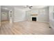 Spacious living room with fireplace, large windows, and hardwood floors at 95 Purslane Dr, Franklinton, NC 27525