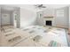 Bright living room with modern fireplace, abundant natural light, and open layout to the kitchen at 95 Purslane Dr, Franklinton, NC 27525