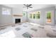 A Living Room featuring a fireplace with shiplap and a wood mantle at 95 Purslane Dr, Franklinton, NC 27525