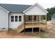 The back of the house features a spacious deck perfect for outdoor entertaining at 95 Purslane Dr, Franklinton, NC 27525