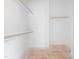 Spacious walk-in closet with wooden clothing rods and a shelf, ready for customization at 95 Purslane Dr, Franklinton, NC 27525