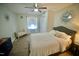Cozy bedroom with a queen-size bed and ceiling fan at 101 Oakmont Ave, Durham, NC 27713