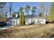 White single story home with mature trees and landscaping at 101 Oakmont Ave, Durham, NC 27713