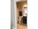 Bathroom with tiled floors, vanity, toilet, towel rack, and shower/tub, providing a functional and clean space at 108 Kaspurr Dr, Garner, NC 27529