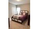 Inviting bedroom with a comfortable queen-sized bed, plush bedding, and neutral carpet for a cozy retreat at 108 Kaspurr Dr, Garner, NC 27529