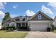 Charming single-story home with manicured lawn and a two-car garage on a sunny day at 108 Kaspurr Dr, Garner, NC 27529