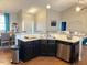 Kitchen island with granite countertops and stainless steel sink overlooking living and dining areas at 108 Kaspurr Dr, Garner, NC 27529