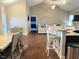 Open-concept living room and kitchen with hardwood floors and bright, airy atmosphere at 108 Kaspurr Dr, Garner, NC 27529