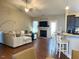 Inviting living room with a fireplace, comfortable seating, and an open layout to the kitchen at 108 Kaspurr Dr, Garner, NC 27529
