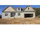 New construction home with two-car garage and attractive exterior at 129 Lassiter Ridge Dr, Four Oaks, NC 27524