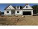 New construction home with a two-car garage and vinyl siding at 129 Lassiter Ridge Dr, Four Oaks, NC 27524