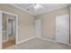 Bedroom with ceiling fan and access to bathroom at 201 Presque Isle Ln, Chapel Hill, NC 27514