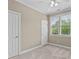 Spacious bedroom with ceiling fan and neutral carpeting at 201 Presque Isle Ln, Chapel Hill, NC 27514