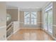 Bright dining room with hardwood floors and access to a deck at 201 Presque Isle Ln, Chapel Hill, NC 27514