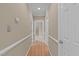 Bright hallway with wood floors and neutral walls at 201 Presque Isle Ln, Chapel Hill, NC 27514