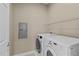 Laundry room with washer, dryer, and shelving at 201 Presque Isle Ln, Chapel Hill, NC 27514
