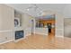 Living room with hardwood floors, fireplace, and kitchen view at 201 Presque Isle Ln, Chapel Hill, NC 27514