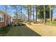 Backyard with a large lawn, trees and room for entertaining in a mature landscape at 205 N Augusta Ave, Benson, NC 27504