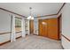 Bright bedroom with neutral carpet, updated paint, wood trim, two windows with bright light and large closet at 205 N Augusta Ave, Benson, NC 27504