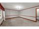 Bright dining room with a chandelier and ample space for entertaining guests at 205 N Augusta Ave, Benson, NC 27504