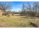 Large backyard with deck and spacious grassy area at 2540 Mayo Lake Rd, Roxboro, NC 27574